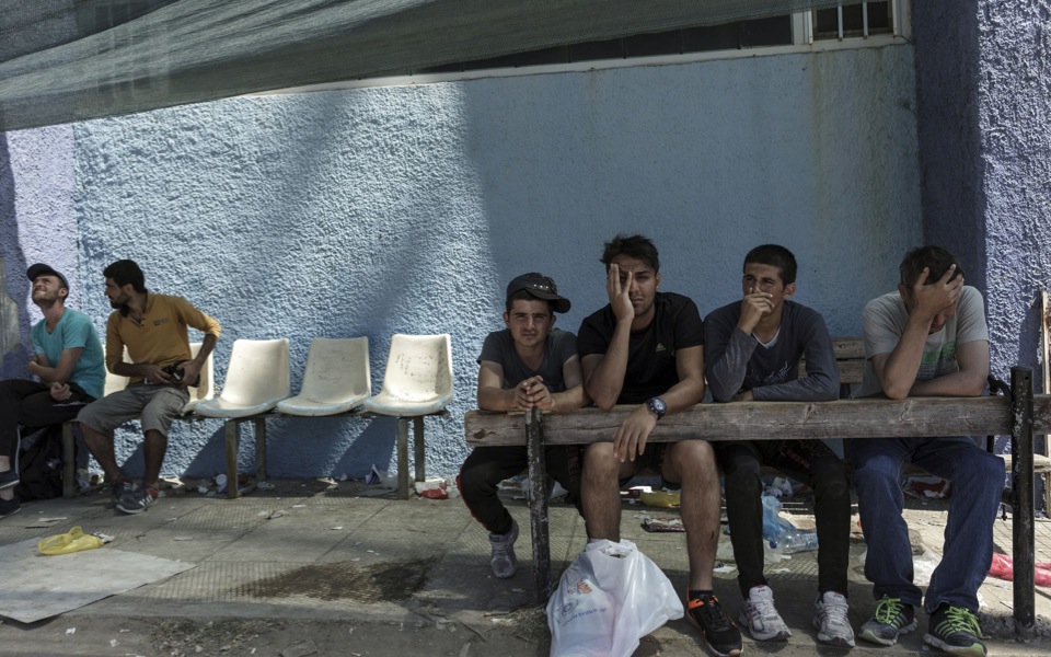 On Lesvos, tourist comforts clash with migrant needs