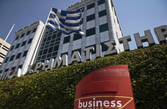 Greek government says discussing draft of third bailout deal