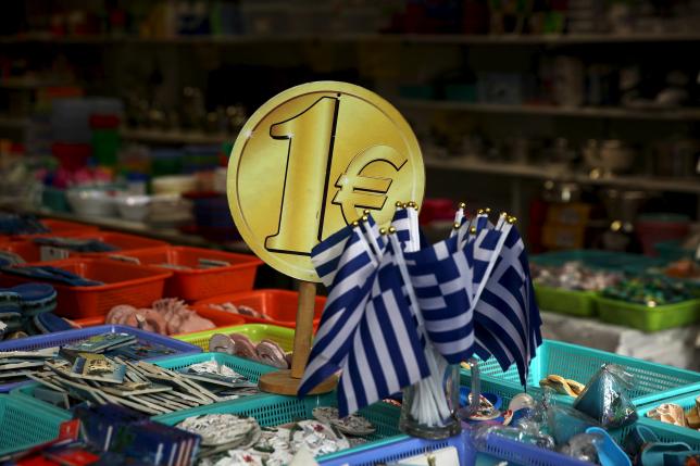 EU officials note progress in Greek bailout talks, deal possible next week