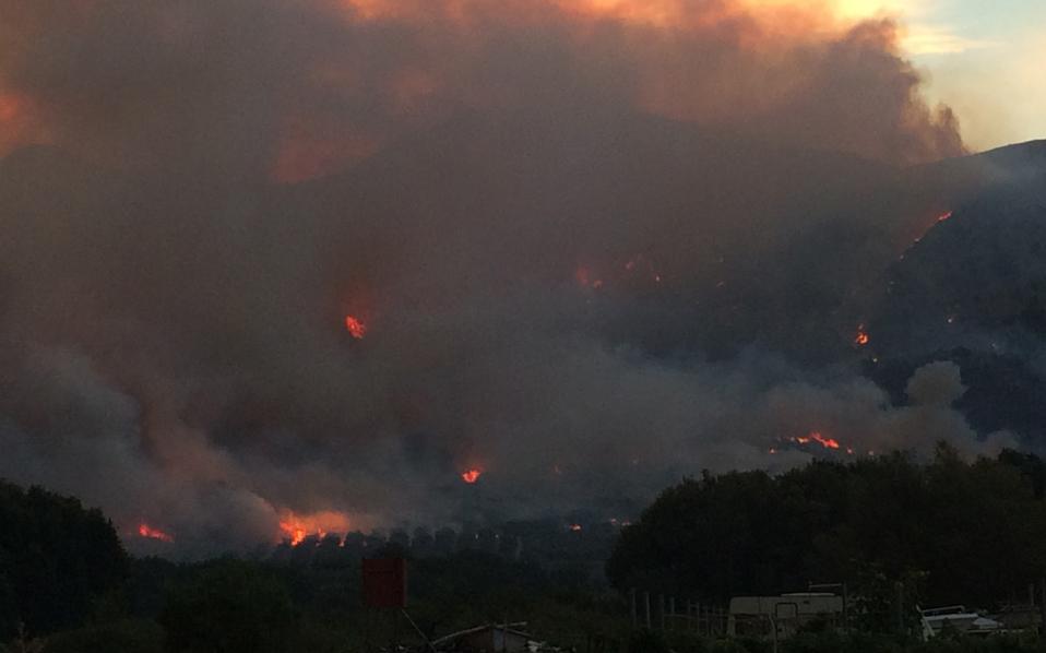 Forest fire close to homes on Mount Parnitha in northern Athens