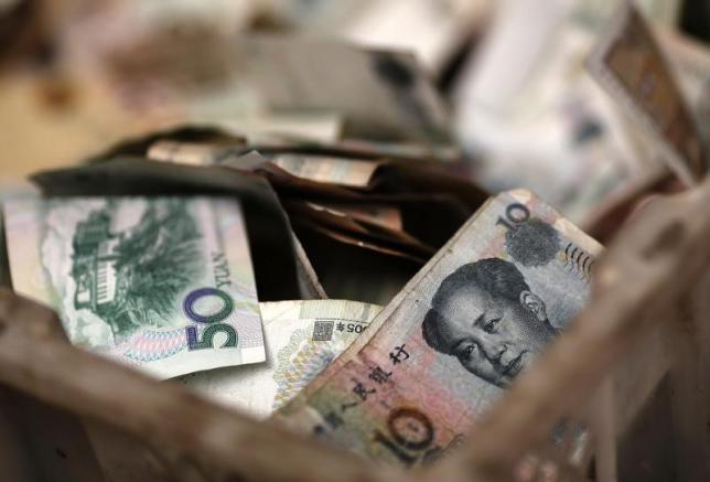 IMF freezes benchmark currency basket, defers any yuan addition