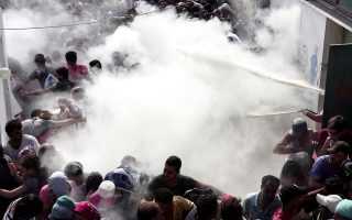 Police beat migrants on Greek island as mayor warns of ‘bloodshed’
