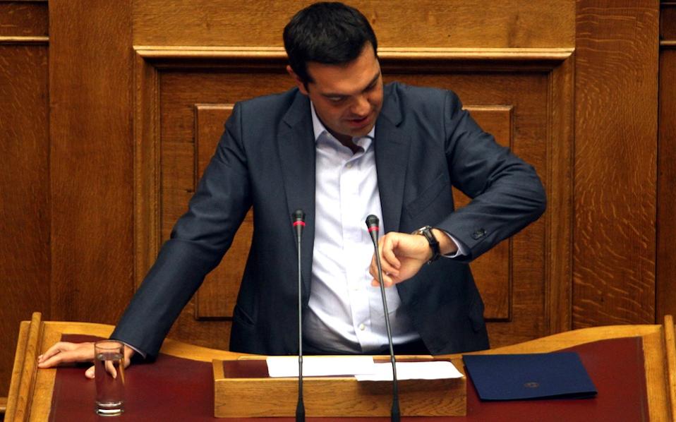 Tsipras wins bailout vote, faces widening rebellion