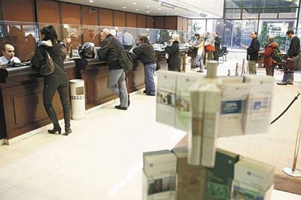 Greek capital controls halt exodus after banks lose $48 Billion