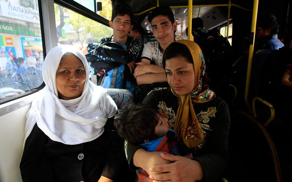 Athens makes city buses available to take migrants to ex-Olympic sites