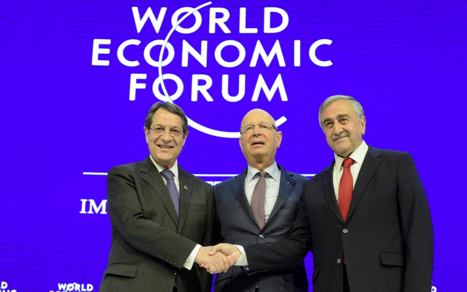 With symbolic handshake at Davos, Cyprus leaders ask elite to back peace