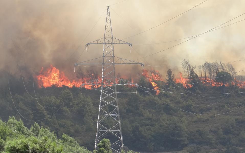 Firefighters battle large blaze on Rhodes, village evacuated