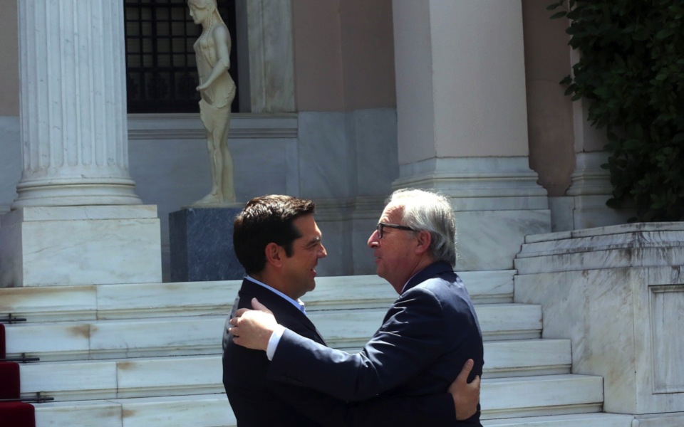 Aid in pocket, Tsipras looks to Juncker’s backing