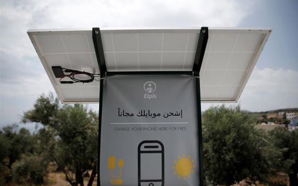 Sun-powered phone charger gives migrants in Greece free electricity