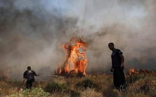 Firemen battle blazes in Attica, Lesvos