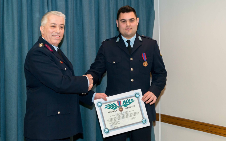 Police officer receives bravery medal for saving child from fire