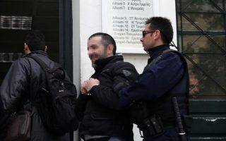 Golden Dawn official remanded over attack on student