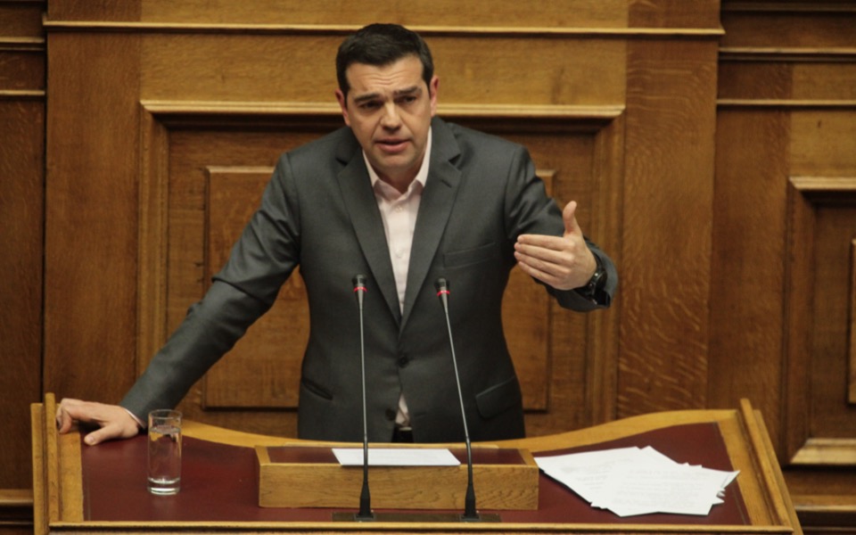 Tsipras defends agreement, vows debt relief, catharsis