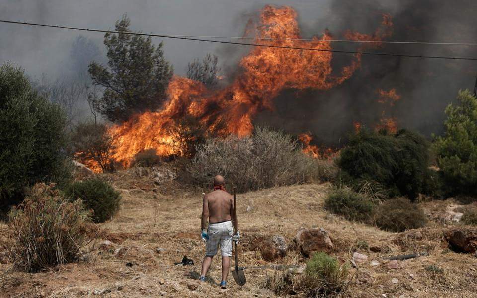 Firefighters battle 54 blazes across Greece, protecting residential areas