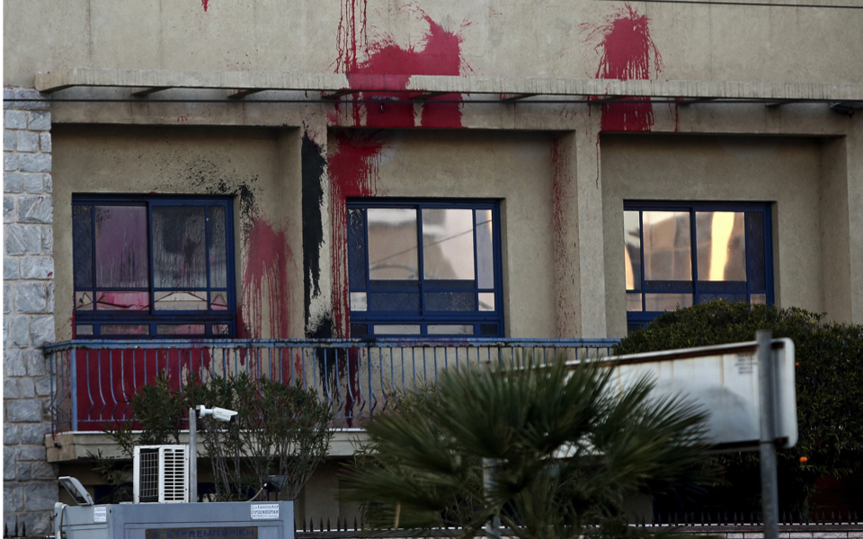 Rouvikonas group members throw paint at Israeli Embassy