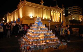 Athens’s Christmas ‘milk tree’ feeds thousands of people in need