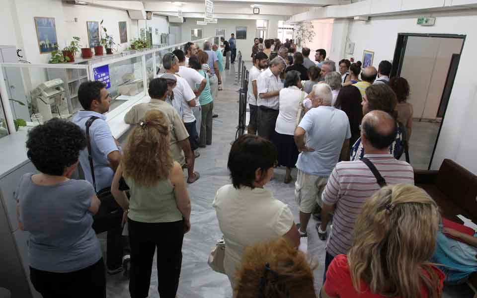 Greeks crushed by tax burden