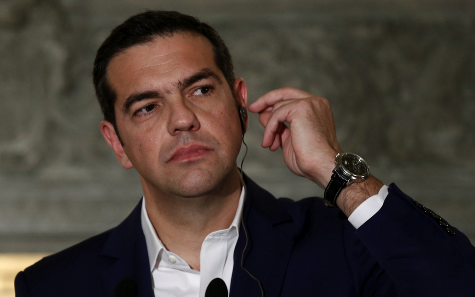 As Tsipras seeks to implement tough measures, aides press for early elections