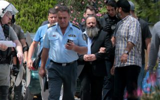 Debt activist Sorras held on crime charges