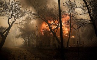 Greek wildfire rages near Athens, forcing residents from homes