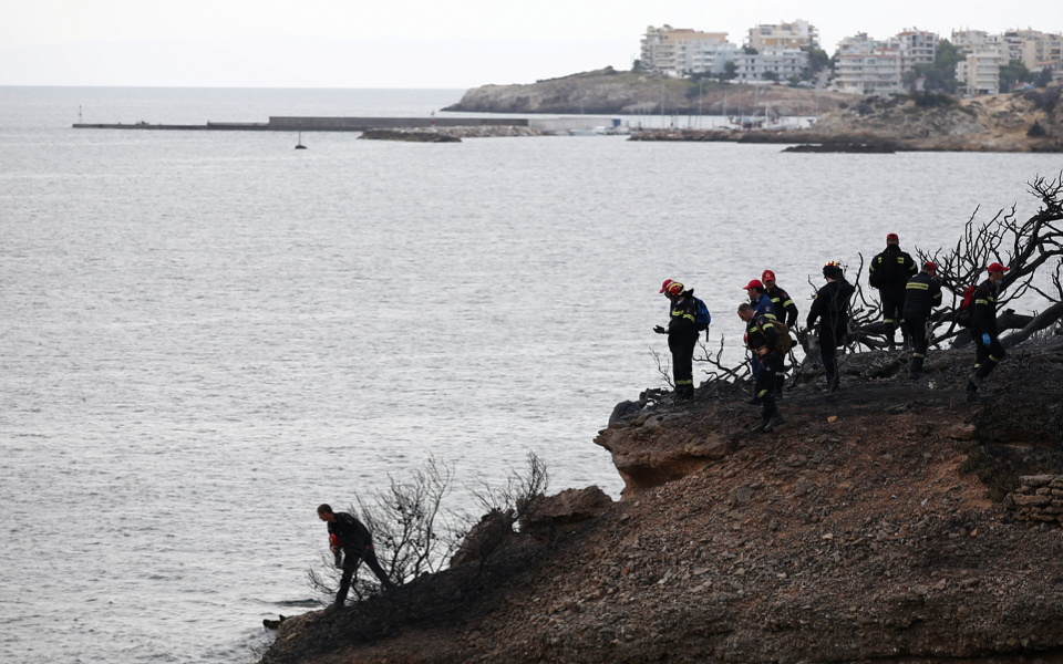 Friends flee into sea, battle waves, as Greek wildfires rage