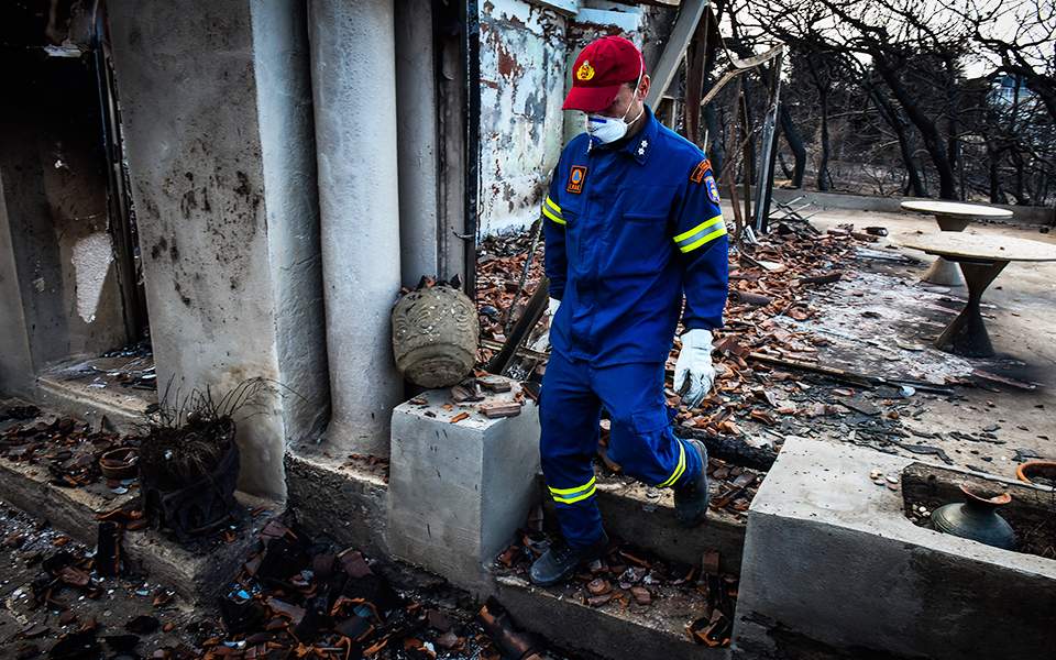 Greek forensics experts work on identifying dead from fire, put toll at 86