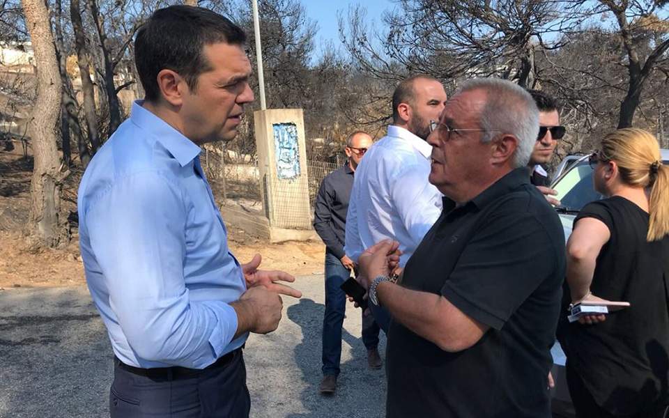 Greek PM visits seaside town hit by wildfires