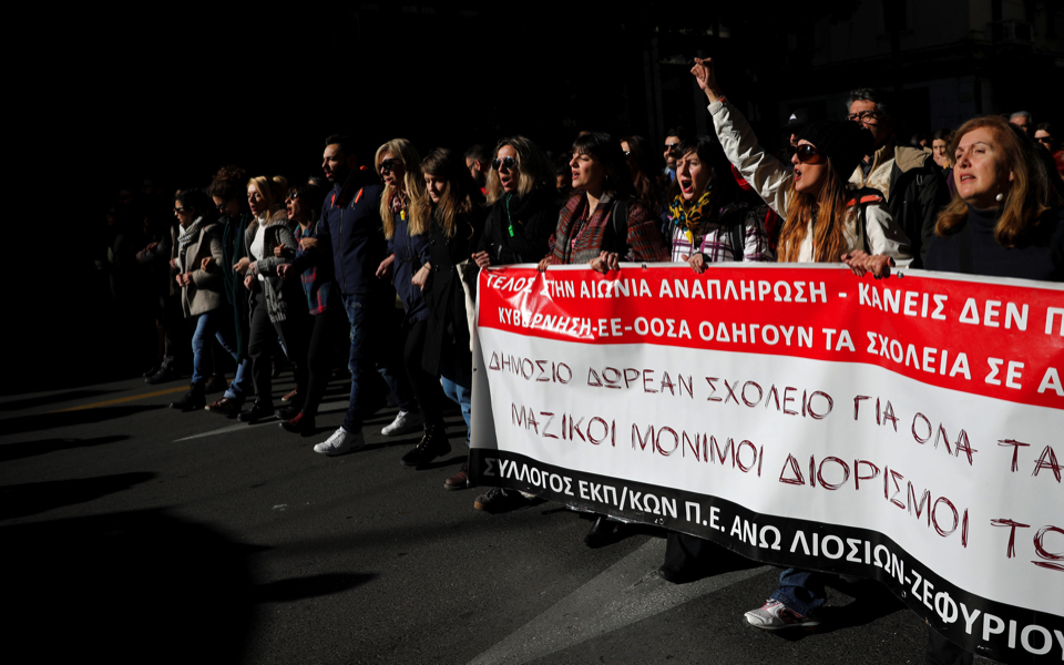 Greek school teachers march through Athens