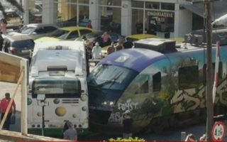 Train crashes with bus near central Athens; no serious injuries reported