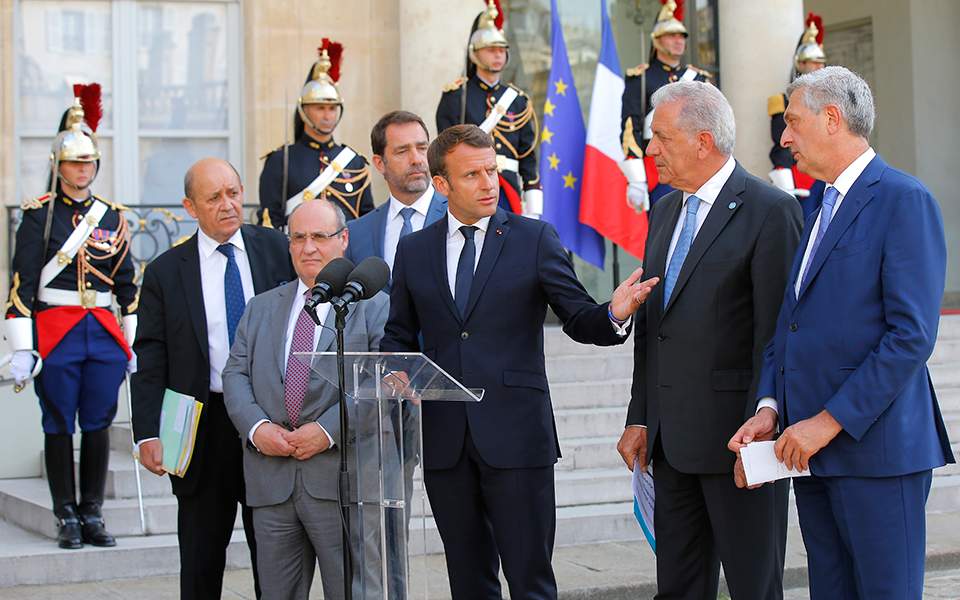 EU countries agree to new migrant influx mechanism, says Macron