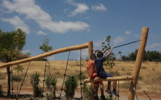 Kids back in fire-razed Rafina playground