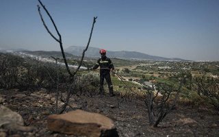 Woman detained over Spata fire