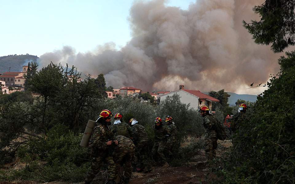 Fire rages on Evia, threat to people averted
