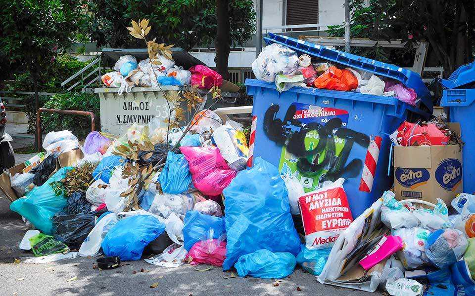 Garbage piles up as staff protest private contracts