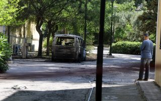 Cars torched outside Athens court complex