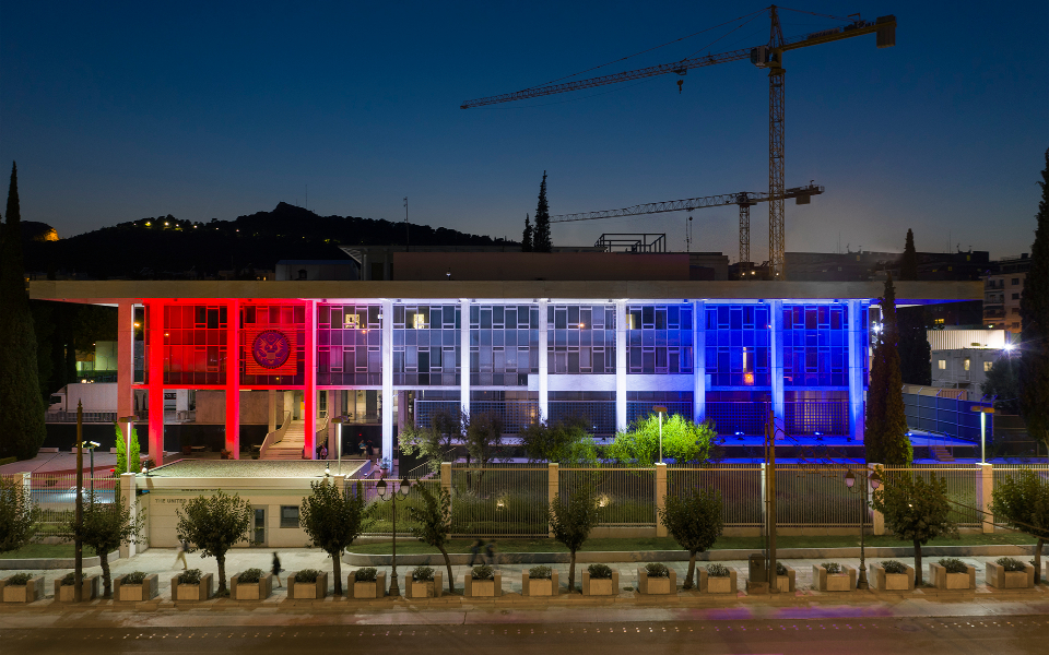 US Embassy building lit in red, white and blue for the 4th of July
