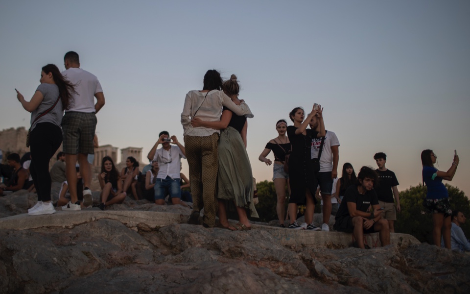 In Acropolis selfies, normality flickers through