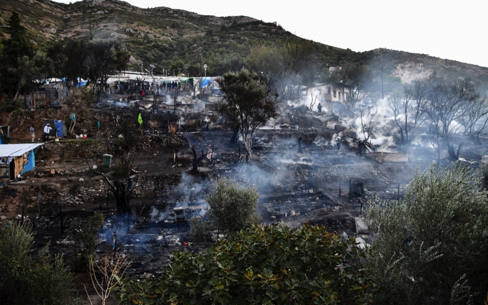 Small fire burns tents in squalid Greek island refugee camp