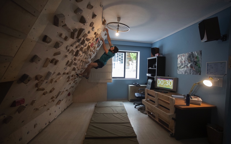Athlete turns living room into climbing wall during lockdown