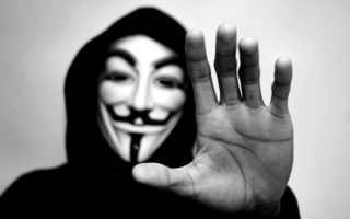 Anonymous attacks Greek central bank, warns others