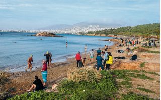 Swimmers drawn to the beach as temperatures rise