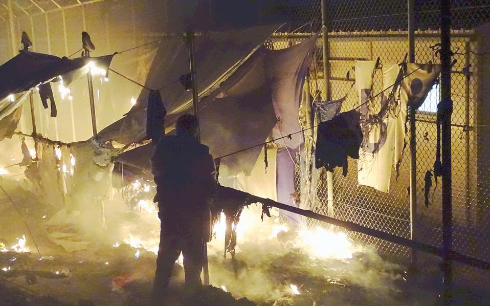 Two dead as fire rages through Lesvos refugee camp