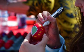 Children in Nafplio decorate red eggs for Easter