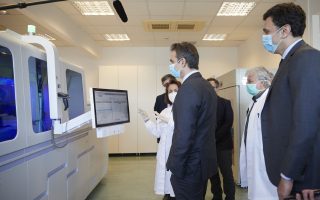 Faster testing will help efforts to relax lockdown measures, says Mitsotakis during visit to EKEA