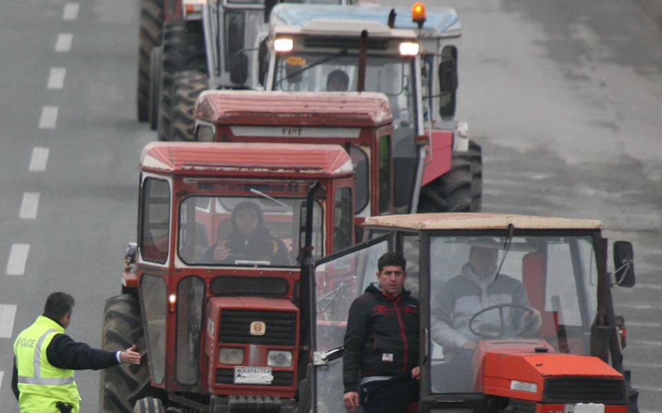 Greek farmers end road blocks, for now