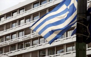 Greece beats budget target for third year, debt edges down