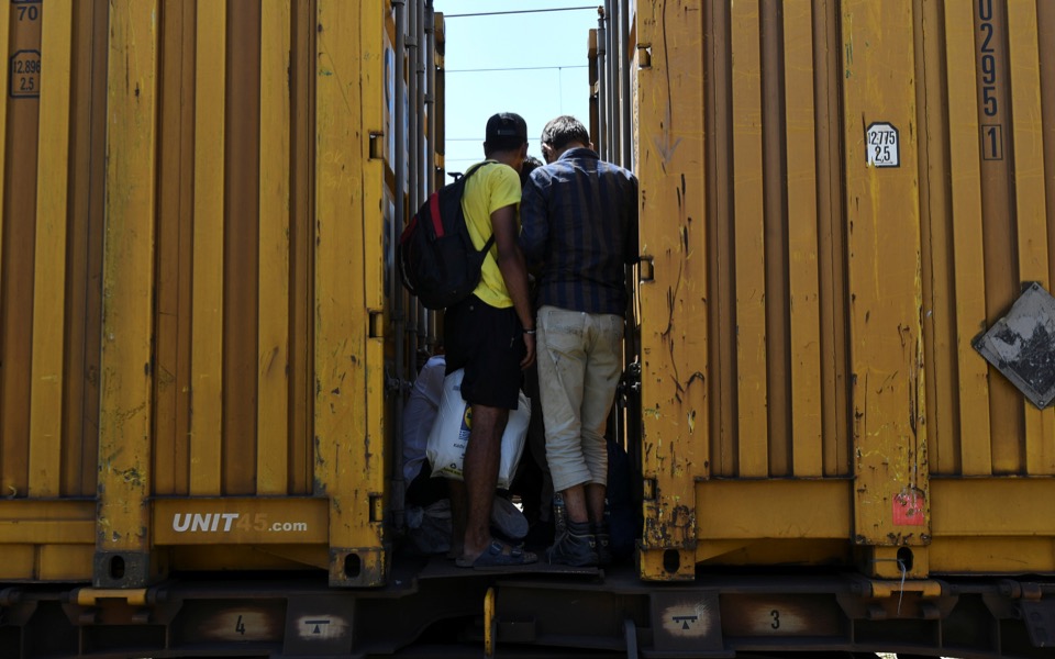 Migrant stowaways ride Greek freight trains seeking escape to north