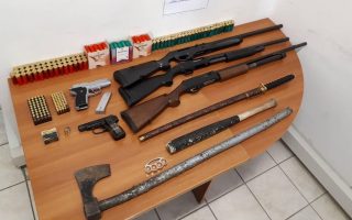 Father, son arrested after house raid turns up illegal weapons