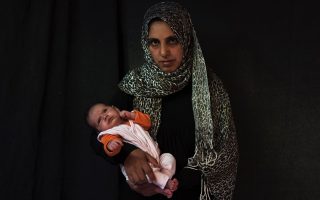 Mothers of newborns in Greek refugee camps cope and hope