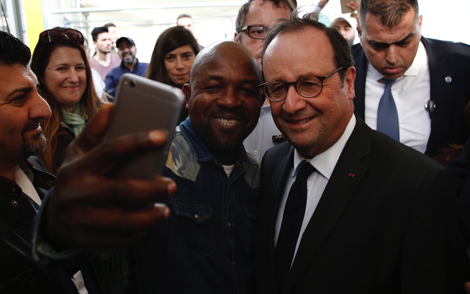 Former French president Francois Hollande visits refugee camp in Athens